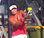 Stephanie Yamada playing a backhand shot during the doubles final