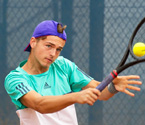 Lucas Vuradin playing a backhand shot during the boys singles final (Photo: Elizabeth Xue-Bai)